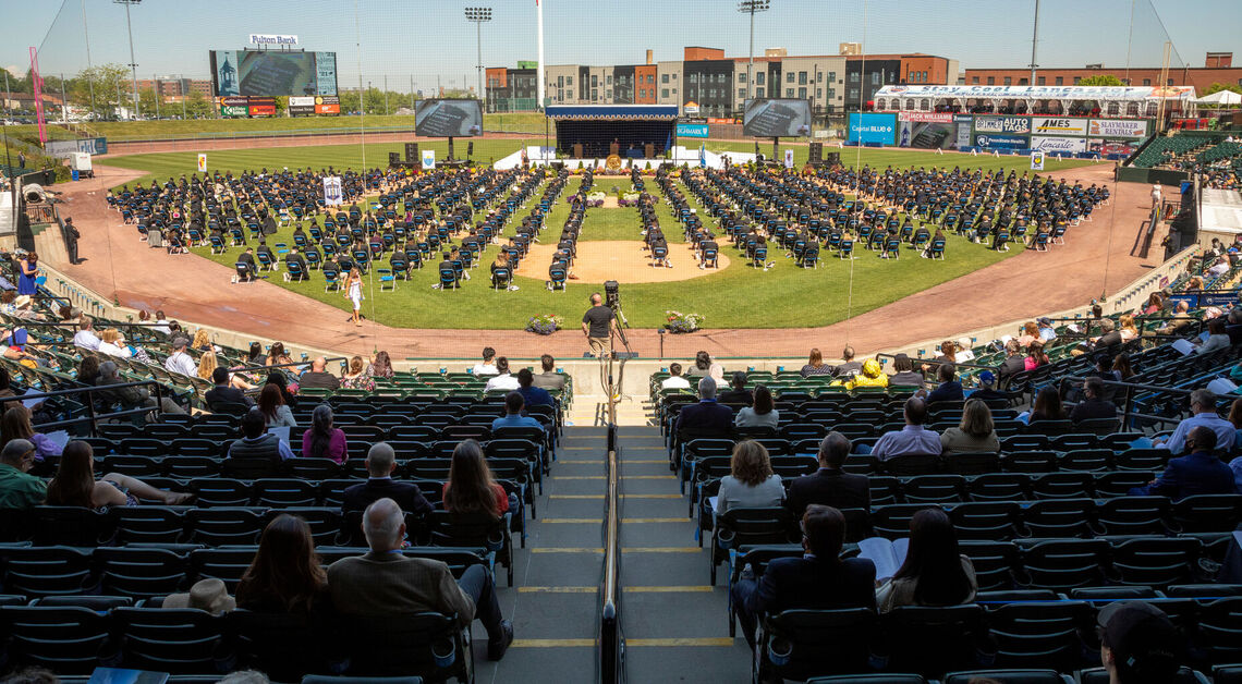 Members of the Class of 2021 â€“ with family and friends watching from Lancaster Clipper Stadium seats â€“ wait to receive their diplomas during F&M Commencement held May 15.