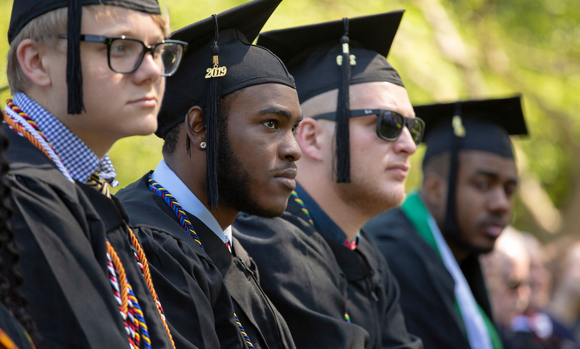Graduates considering the future as they listen to encouragement from the day's speakers.