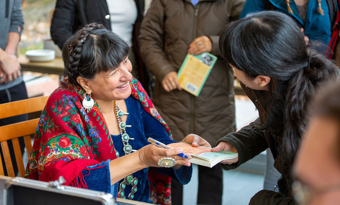 Sandra Cisneros signs books. 