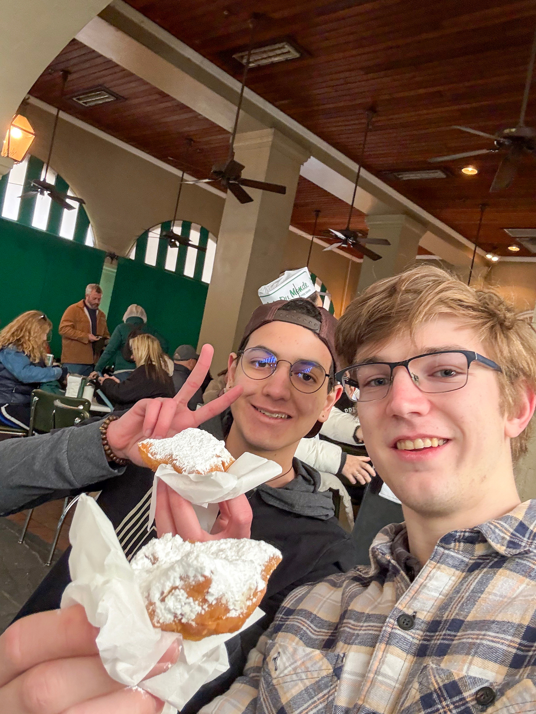 Students enjoy beignets at Cafe Du Monde.