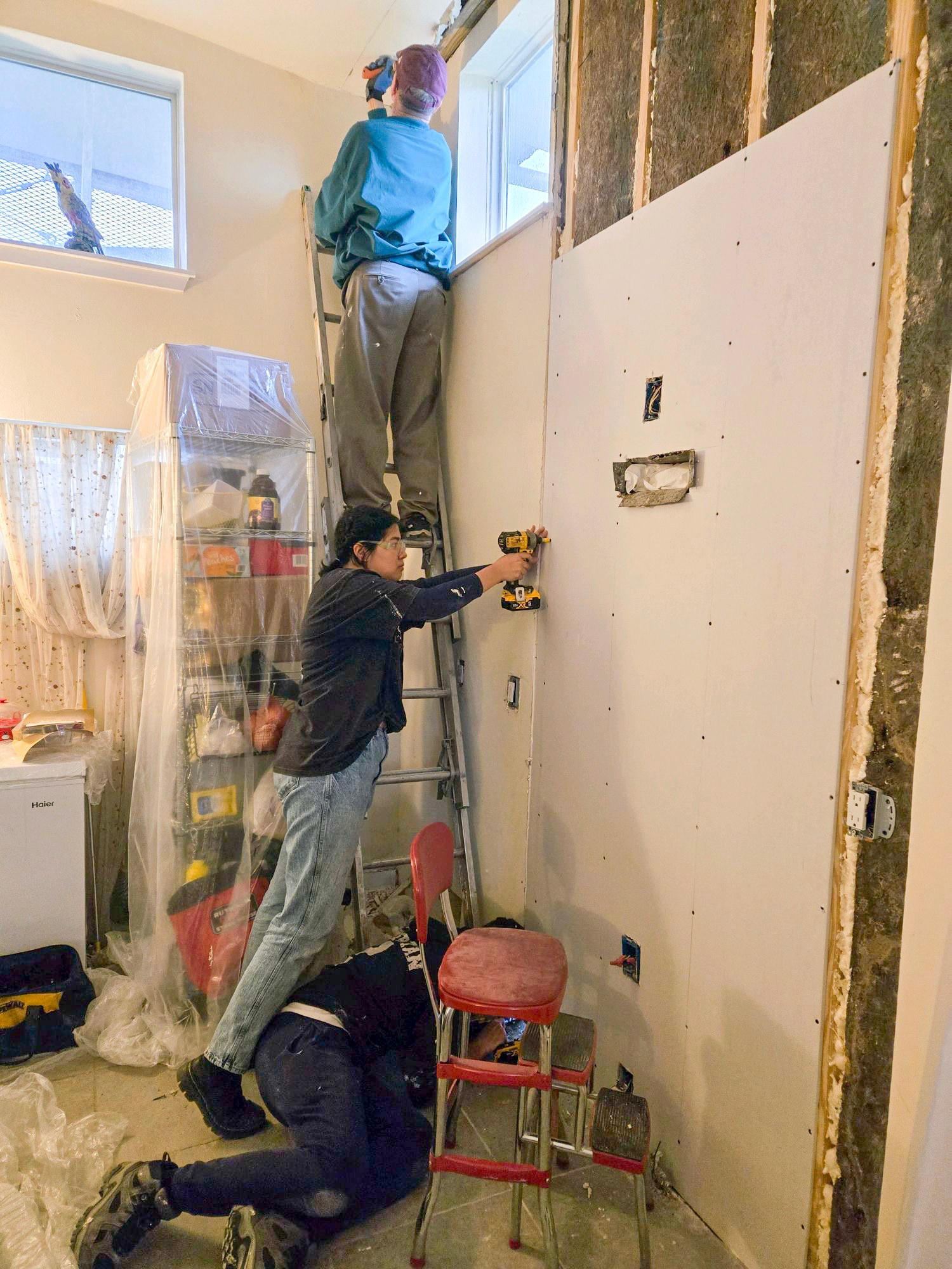 Rebuilding a "Make it Right" home with new drywall.