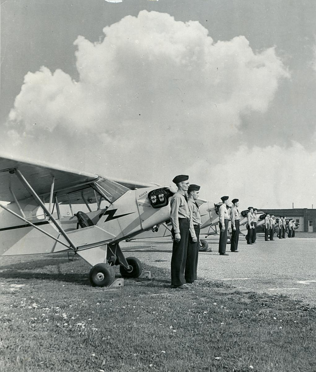 “Flyboys” with their fleet of 33 Piper Cub trainers at Lancaster Municipal Airport.