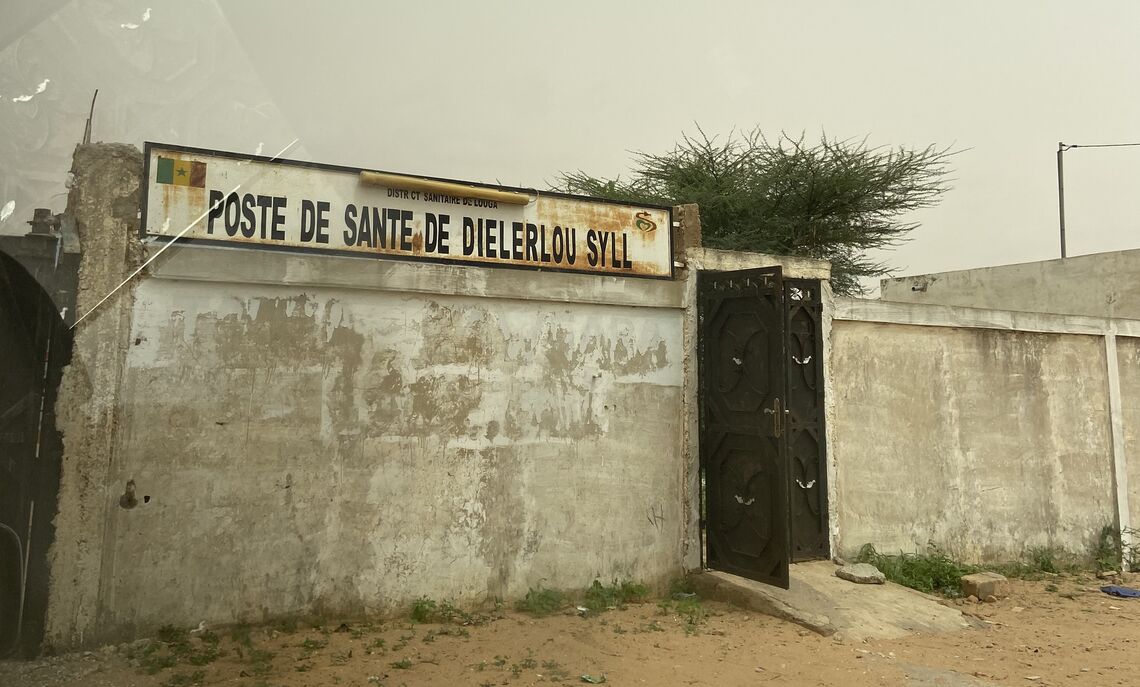 A sign indicating the entrance of a health depot location in Louga, Senegal.
