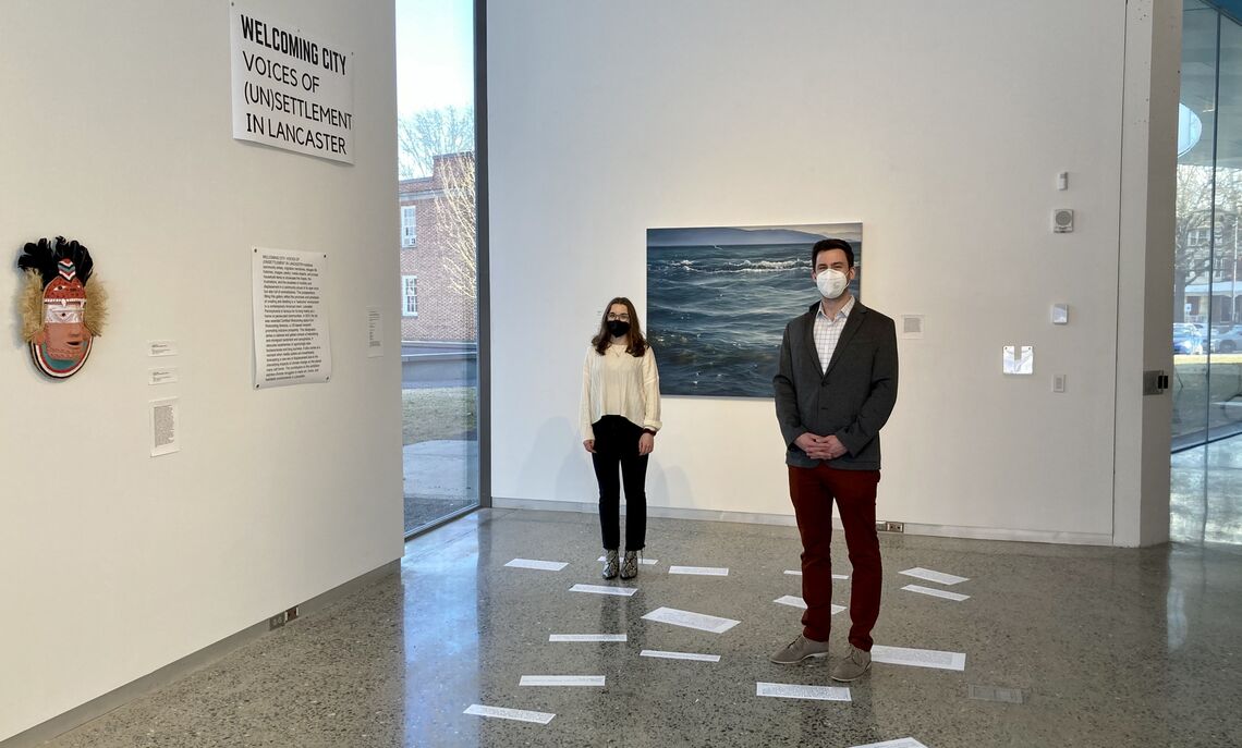 Jacobs with Professor Eric Hirsch, co-curator of the exhibit with research partner, Amer Al-Fayadh, CEO of Communications Essentials.