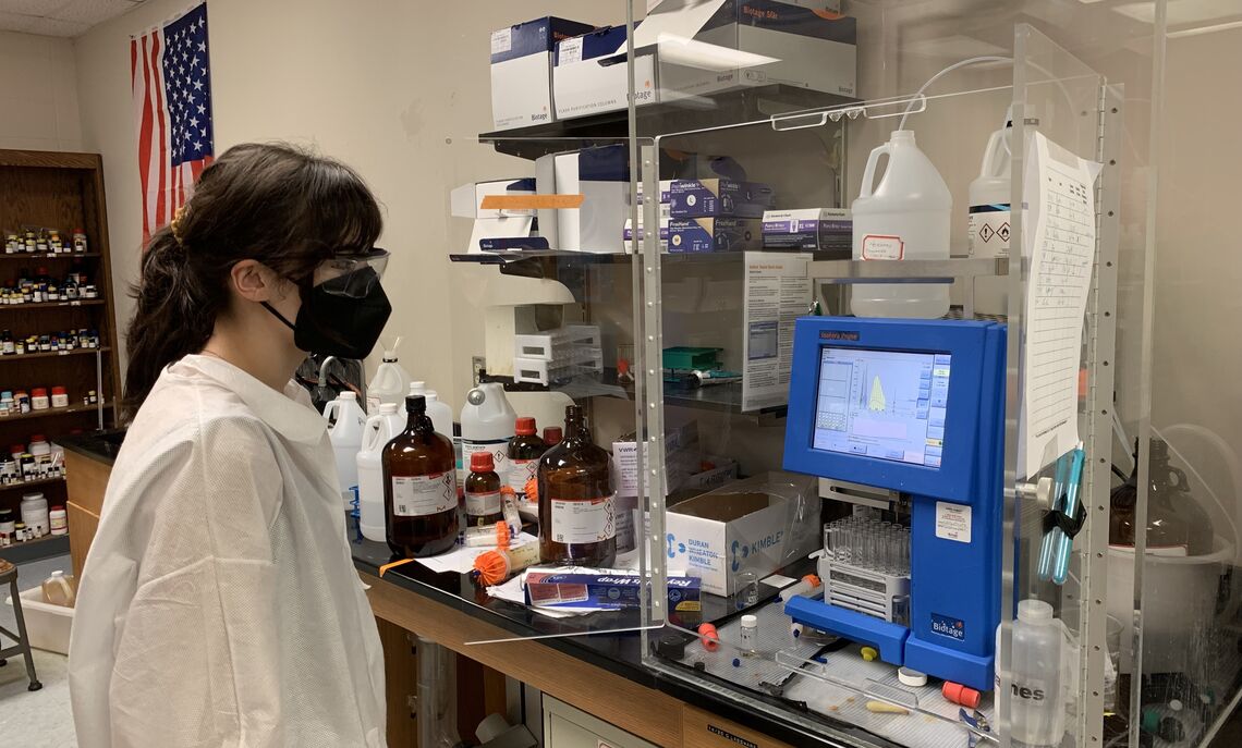 Lyla Naqvi '23 monitors the chemical reactions and says in the lab, "Professor Tasker's expertise and guidance were invaluable throughout the entire process."