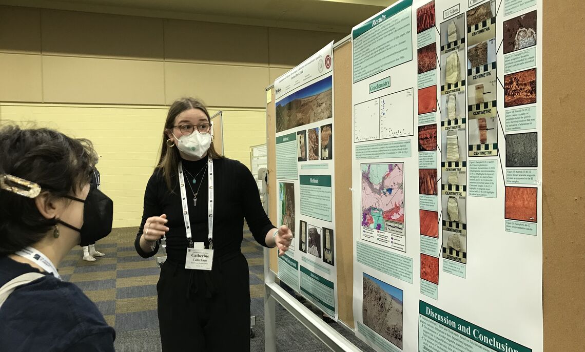 Catie Caterham, senior environmental science major, explains the geochemistry of groundwater aquifers in the Chilean desert.