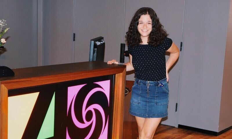 Elena Robustelli '21 poses by the sign for Atlantic Records, a recording label she interned with.