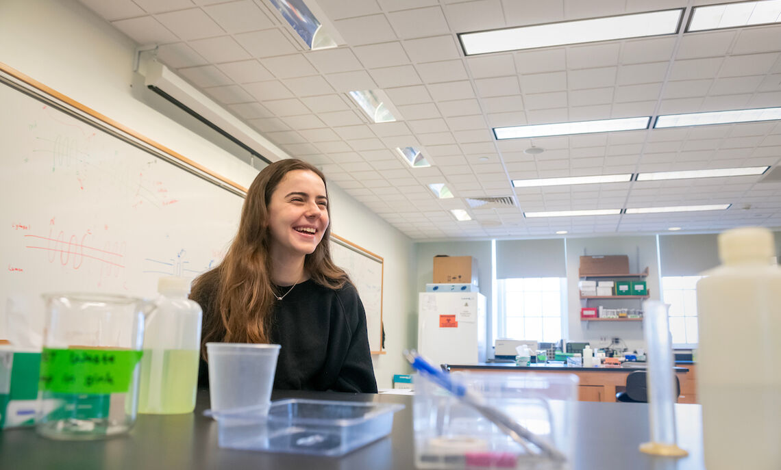 Sara Beqiraj '25 discusses her academic journey in the  campus Life Sciences Pavilion lab which she frequents.
