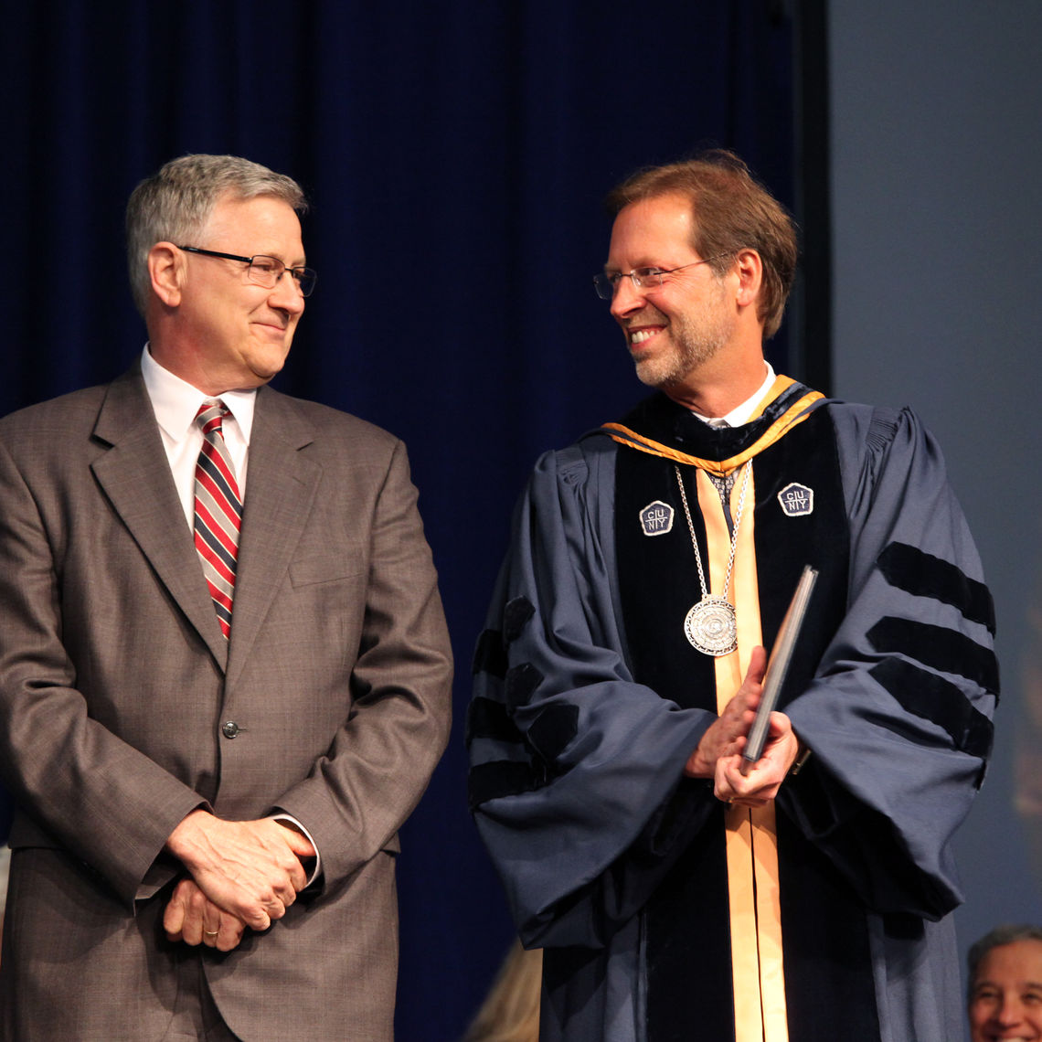Dick Denlinger, here with President Daniel R. Porterfield, has been working for Franklin & Marshall College since 1976.