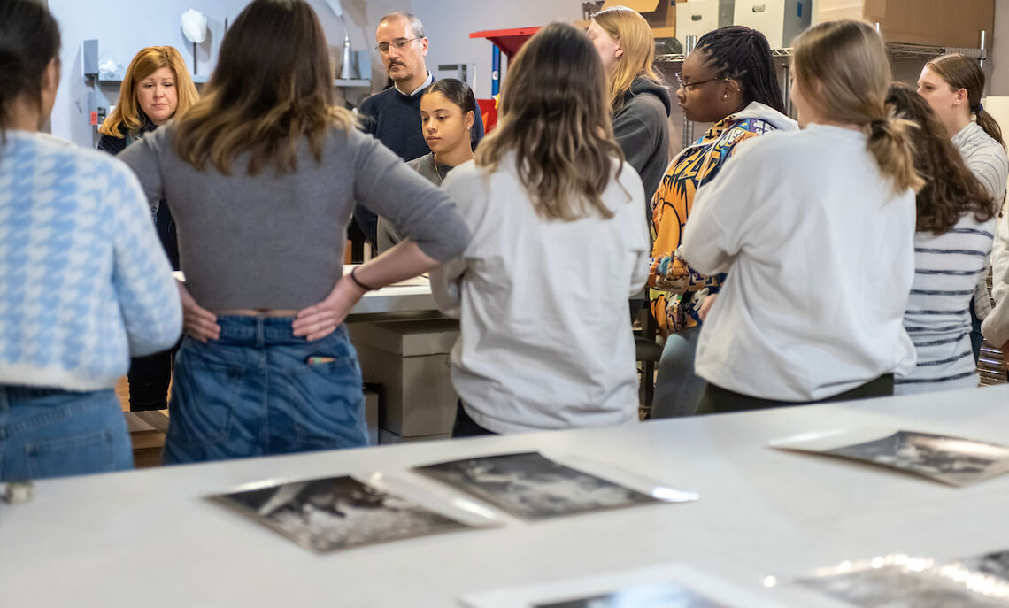 Museum director Lindsay Marino urges students to examine the photos closer: 