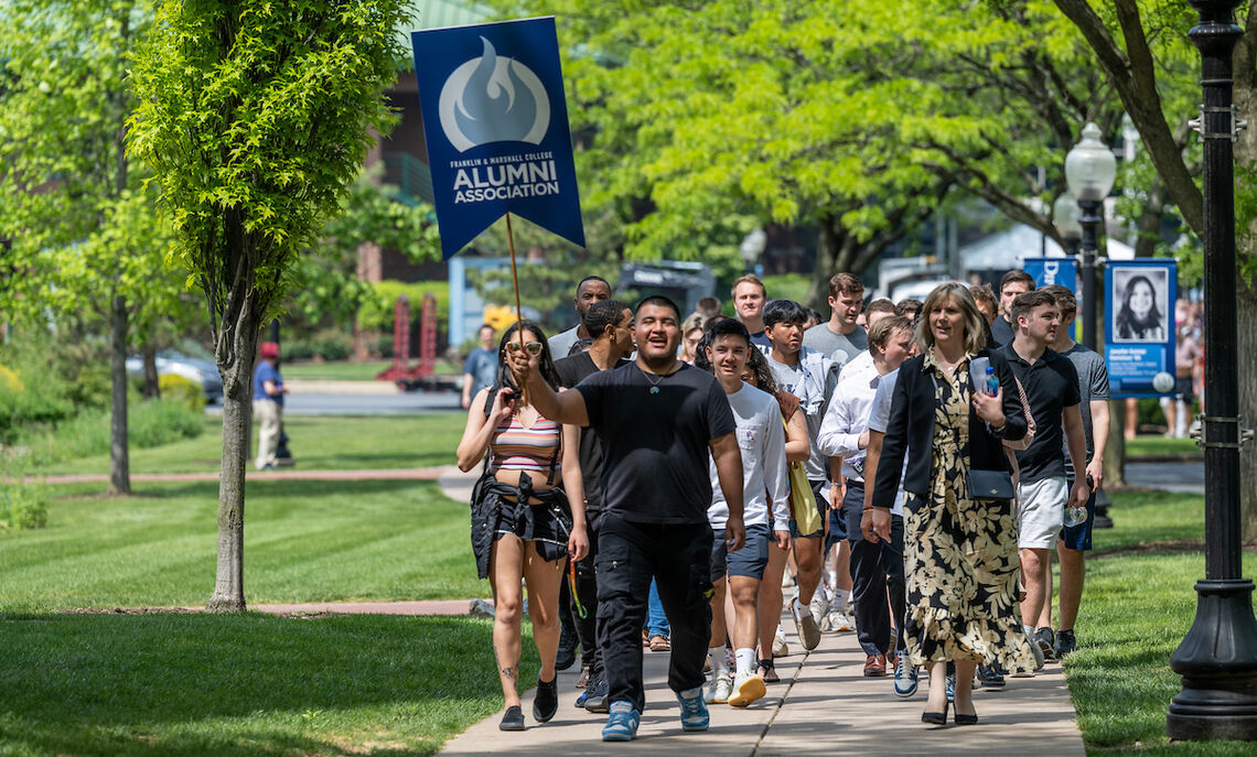 Graduating seniors take a final stroll through campus as members of the Franklin & Marshall community join them to celebrate their four years of achievement.