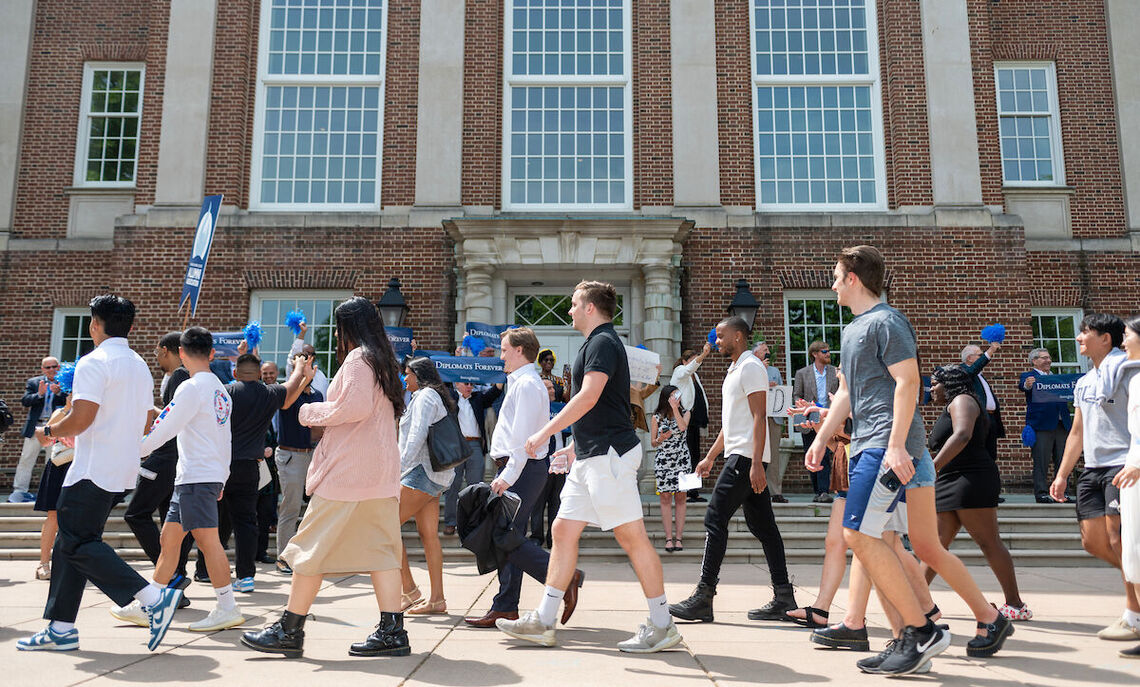 Graduating seniors take a final stroll through campus as members of the Franklin & Marshall community join them to celebrate their four years of achievement.