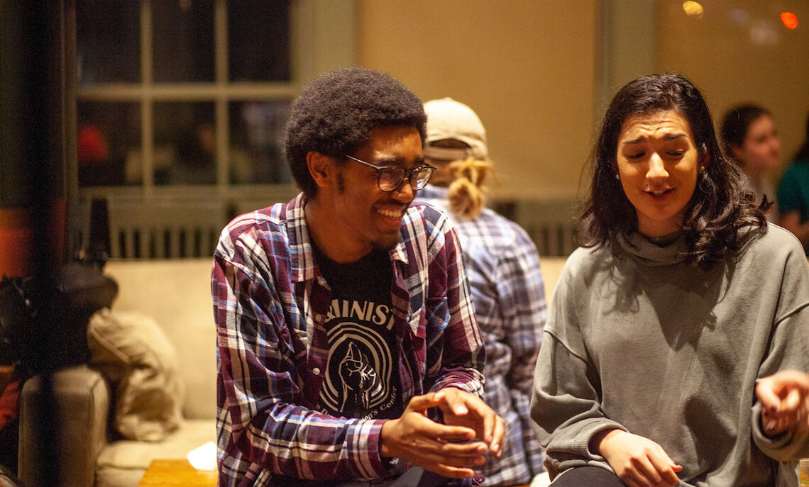 Students gather for the annual Writer's House Thanksgiving meal. Jonny Teklit '20 (left) is a winner of the 2019 Academy of American Poets College Poetry Prize.