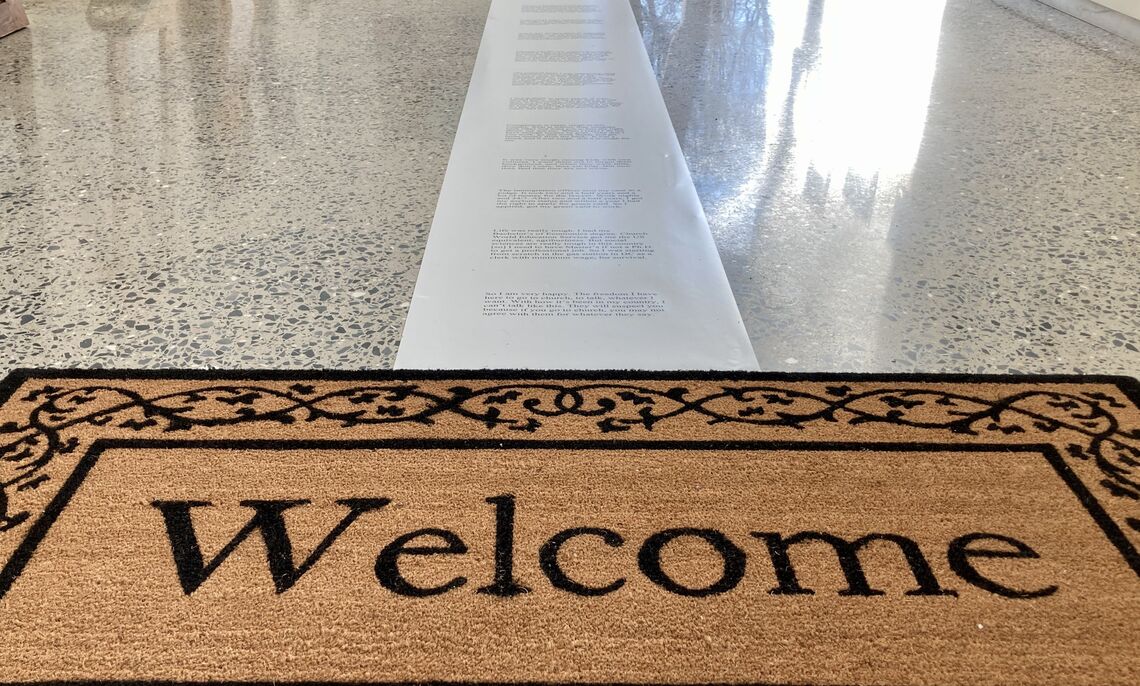 The welcome mat is one of the elements to reflect a migrants journey.