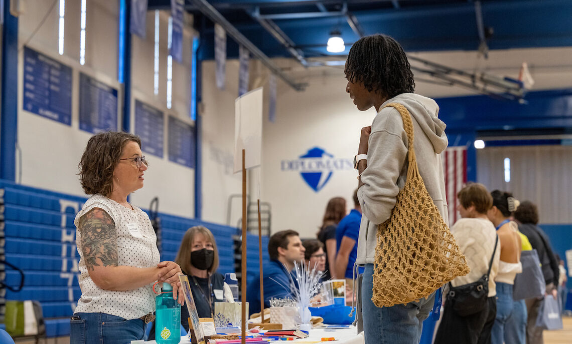 Amy Faust, learning support specialist at F&M, speaks to members of the Class of 2027 at an academic fair during Admitted Student Weekend.